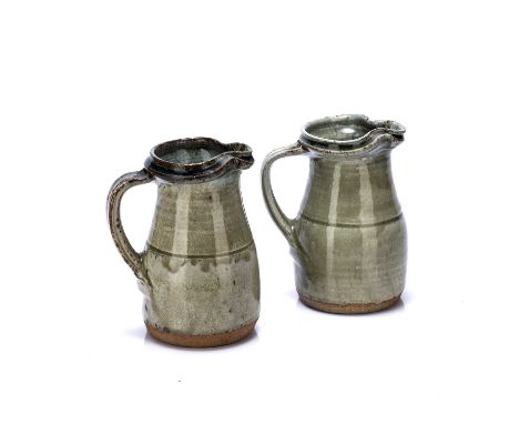 Richard Batterham (1936-2021)two studio pottery jugs, ash glazed, one is 17cm high, the other is 18cm high (2)Crazing and min