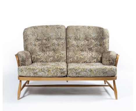 Ercollight elm sofa, with floral upholstered cushions, with Ercol circular label to the underside, 141cm wide including the a