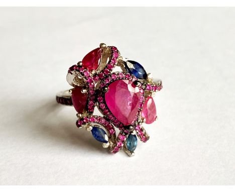 A 925 silver ring set with rubies and sapphires, (O).