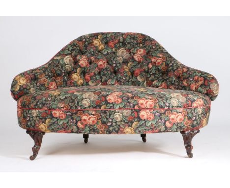 Edwardian parlour settee, the foliate upholstered shaped button back above a bow front seat, raised on scroll carved legs and