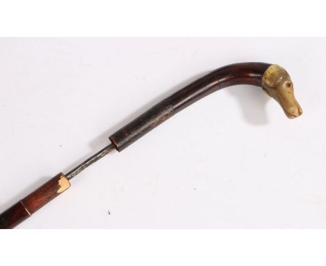 Late Victorian sword stick, the wooden cane with carved horn pommel in the form of a dog's head, overall length 99cm