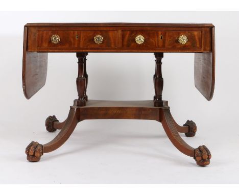 Regency mahogany, ebony and boxwood strung sofa table, with two drop leaves and four frieze drawers, raised on four turned su