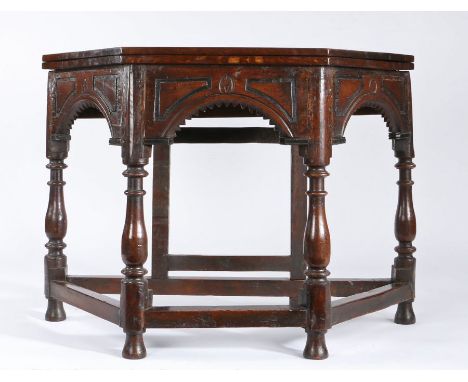 A Charles II oak credence-type table, circa 1680 and laterHaving an octagonal fold-over top, the base of canted form, with th