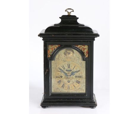 George III ebonised bracket clock, the pagoda top with brass carrying handle above an arched glazed door, the brass dial with