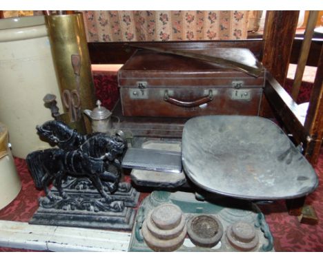 Two heavy vintage leather suitcases, 3 walking sticks, iron balance scales, claret jug, two cast iron door portes - horses