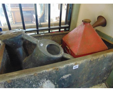 A galvanised iron water tank, an old English watering can, large oil canister and a 19th century pedestrian gate