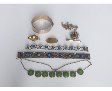 A collection of silver and white/yellow metal items to include a yellow metal brooch in the Art Nouveau style set with turquo