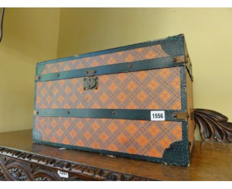 A small late 19th century travelling trunk with tartan and simulated snakeskin banded detail, 50 cm maximum