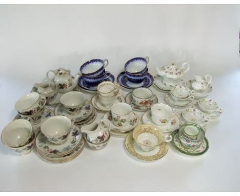 A collection of Victorian child's tea wares with painted floral sprigs comprising tea pot, slop bowl, milk jug, a pair of cak