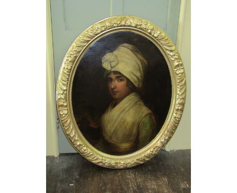 An oil painting on canvas in the late 18th century manner showing a bust length portrait of a lady in white turban style head