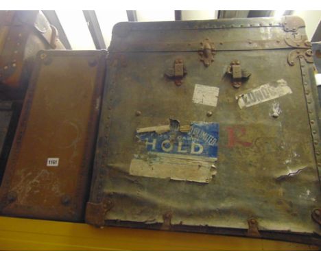 Four vintage travelling trunks including a pine example with iron work handle, a further canvas and timber bound example and 