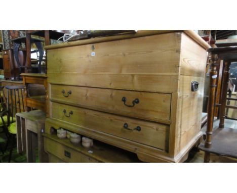 A reclaimed stripped and white waxed mule chest, the hinged lid over a base fitted with two long drawers upon bracket feet, 1