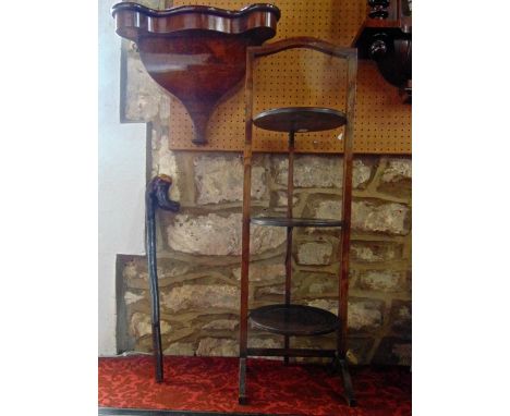 A Victorian figured walnut wall bracket with serpentine outline and shaped base, a further short knob Kerrie and an Edwardian