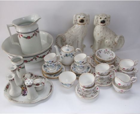 A pair of 19th century Staffordshire spaniels with gilt decoration, a jug and basin set with floral garland detail comprising