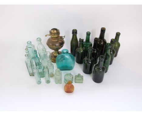 A collection of antique and vintage glass bottles including examples with moulded descriptions including James Williams, Narb