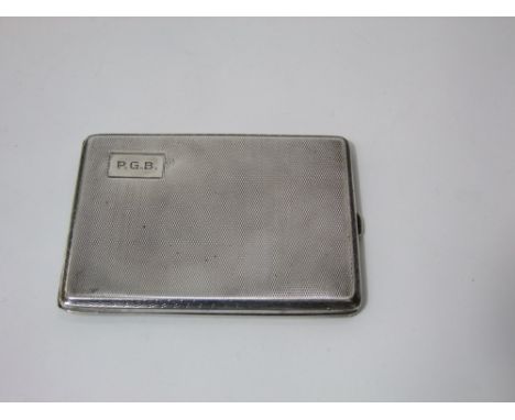 A large silver cigarette case with engine turned decoration, Birmingham 1929, 5.5 oz approx