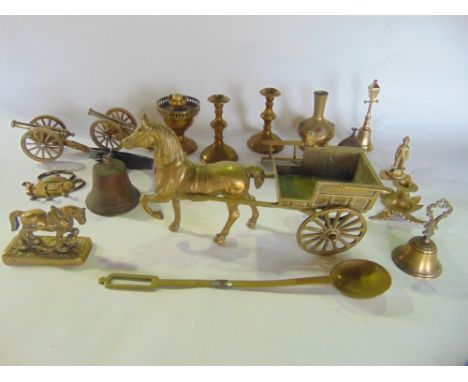 A box containing a collection of brass metalware to include cast brass horse and cart candlesticks, etc, together with variou