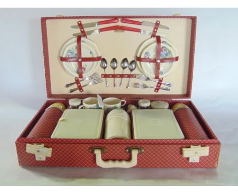 Vintage cased extensive picnic set comprising plates, flask, tupperware, etc, together with a further small leather briefcase