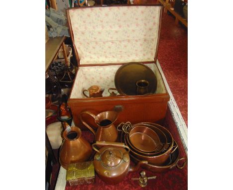 A good tin trunk filled with various copper and brass ware to include graduated jugs, jam pans, a 19th century sampler, etc