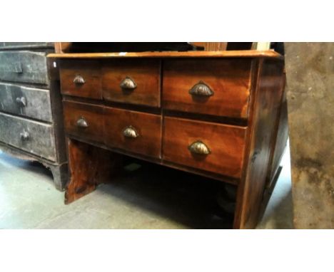 A vintage pine shop counter fitted with six frieze drawers and open base, 110 cm wide