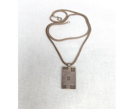 A sterling silver ingot pendant on articulated rope twist sterling silver chain, 27 gms