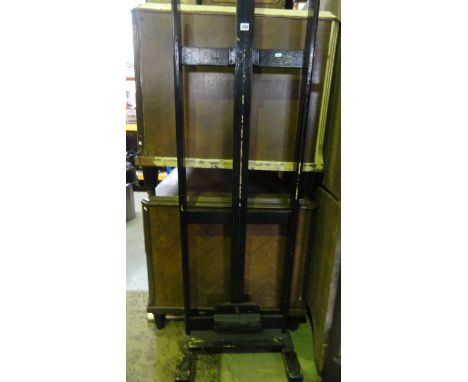 A floor standing easel with adjustable framework and one further example, similar, smaller