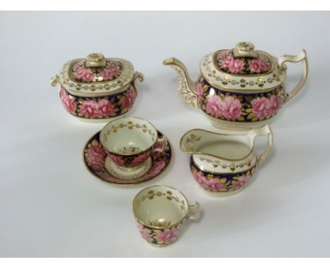 A collection of early 19th century tea wares in the Coalport manner with pink open rose decoration and gilt leaf detail on a 