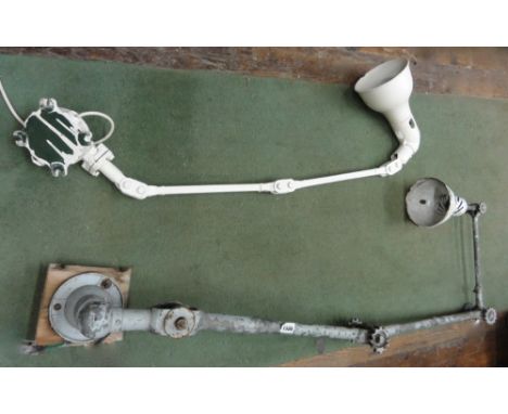 Two vintage industrial articulated wall fitted lamps to include one by Dugdills