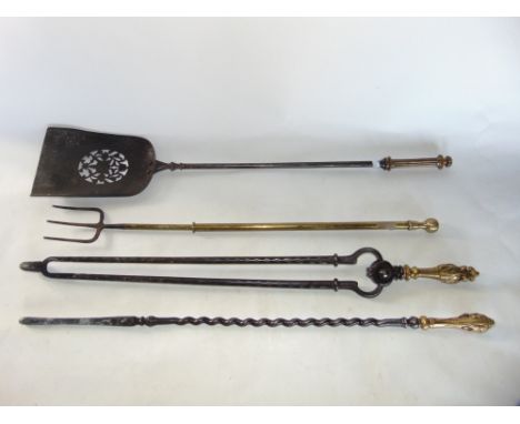 A set of four fire irons to include a telescopic toasting fork