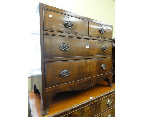 A small regency mahogany caddy top bedroom chest of two long and two short drawers with well matched flame veneers over a sha