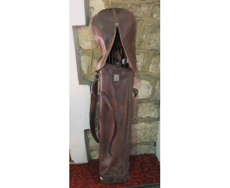 Vintage set of golf clubs within a leather bag