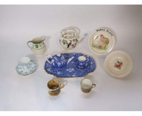 A 19th century Wedgwood cream ground teapot of globular form with printed and infilled humming bird detail and with faint imp