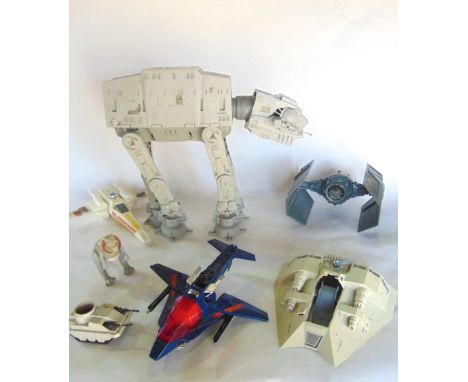 A collection of original Star Wars toys to include ATAT Walker, X-wing, Tie fighter, etc