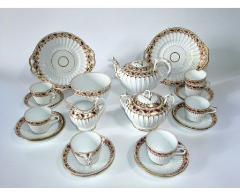 A collection of Victorian tea wares of fluted form with painted and gilded leaf decoration comprising tea pot, covered sucrie