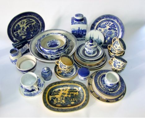 A collection of blue and white printed ceramics including reproduction ironstone caddy and cover, various willow pattern plat