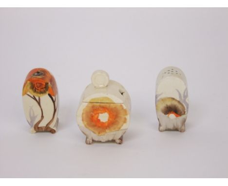 A three piece Clarice Cliff Bizarre condiments set in the Rhodanthe pattern with orange, brown and mauve painted detail compr