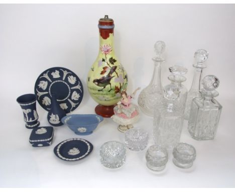 A 19th century opaque glass lamp base with decoration of a bird and insects, five various glass decanters and stoppers includ