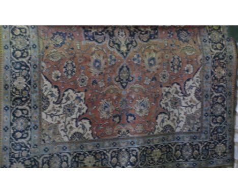 Large Kashan carpet decorated with various scrolled floral medallions upon an ivory ground, 400cm x 275cm