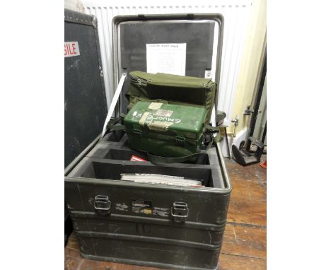 A military steel flight cased trunk fitted with various aviation books and military equipment together with a military boxed 