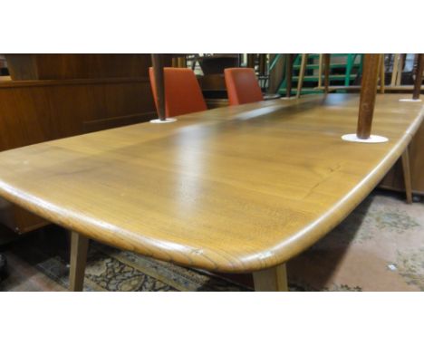 A good, rare Ercol light elm extending dining table, the planked top upon five splayed legs, 72 cm high x 226 cm long extende