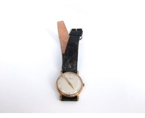 An unmarked yellow metal Smiths Imperial gentlemens wristwatch with cream enamel dial and baton numerals, good working order