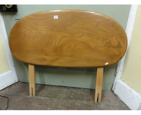 An Ercol light elm single headboard, 100 cm long approx