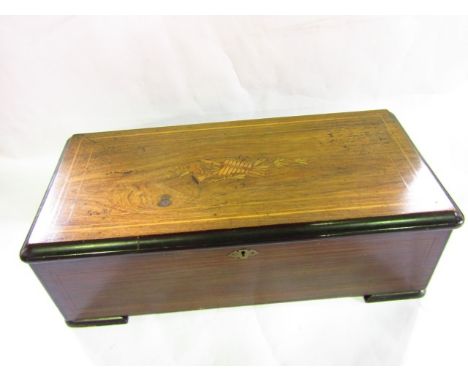 A good large rosewood and boxwood inlaid music box, the interior with good comb and decorated with cast metal lyre, 30cm wide