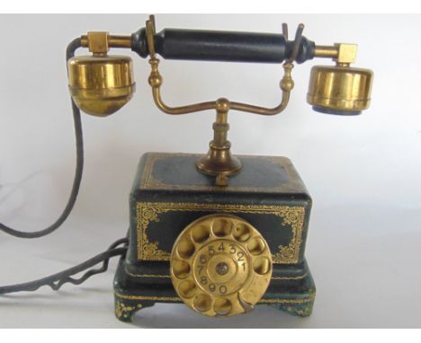 An interesting vintage gilt leather wrapped telephone, 26 inches high