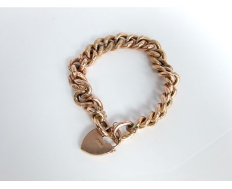 A 9ct gold curb link chain bracelet set with 9ct heart locket 19.4 gram