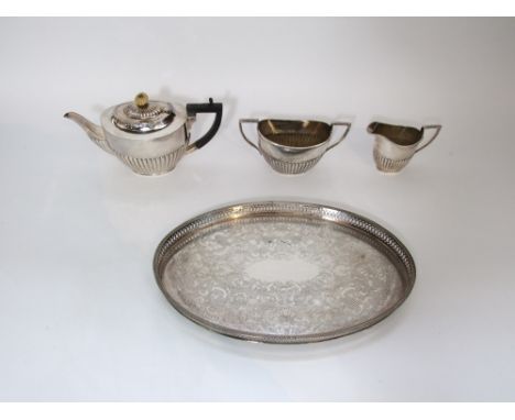 A Regency style silver plated three piece tea service comprising tea pot, milk jug and twin handled sucrier with half fluted 