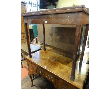 A late 19th century mahogany fold over top D end card table on moulded supports