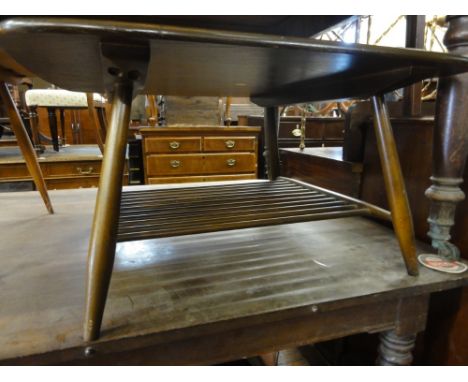 An Ercol dark elm square coffee table with spindled under tier, 40 cm high x 76 cm long approx