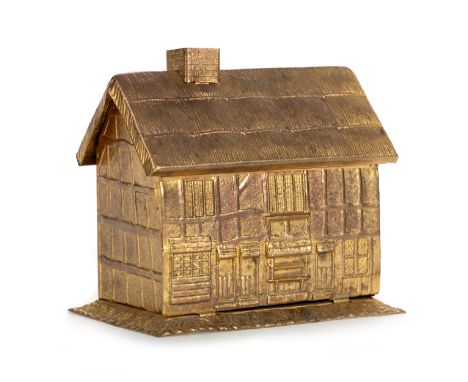 modelled as a thatched house, complete with thread and thimble, bearing makers name to base 8cm wide  This lot closes well, w