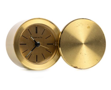 the rotating cover opening to reveal a circular dial with baton hour markers, with stamped makers name for Tiffany &amp; Co t